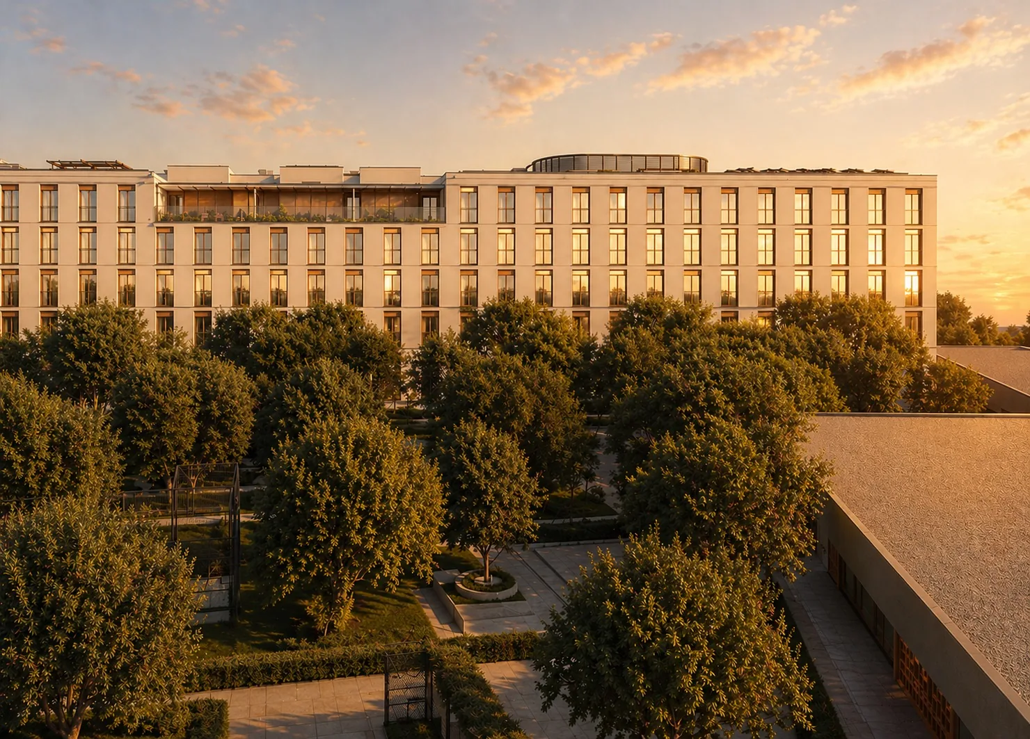 Rendu de la façade de Vik Living au coucher du soleil, avec le jardin au premier plan